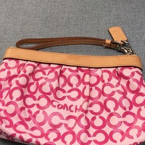 Coach wristlet pink with tan leather strap